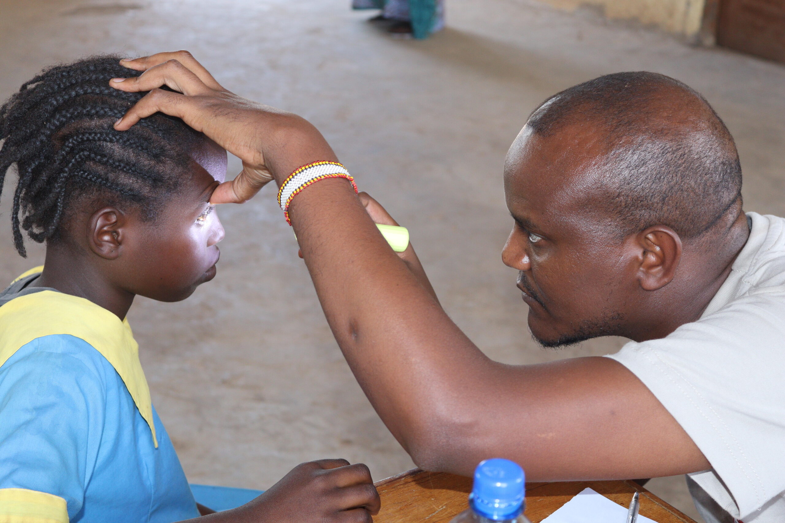 A health worker carrying out an eye examination